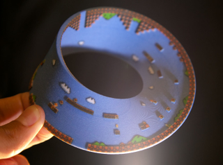 Illustration for article titled Super Mario Bros. Level 1 Recreated On A...Mobius Strip?